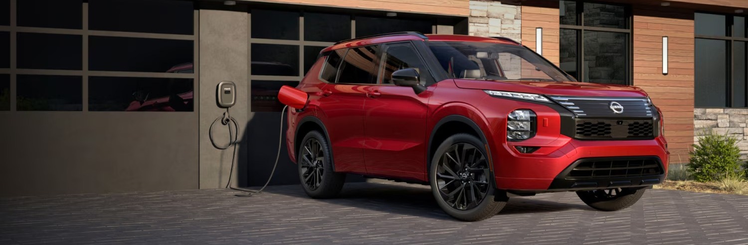 2026 Nissan Rogue PHEV plugged into charger
