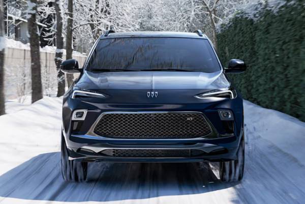 A 2026 Buick Encore GX drives along a snowy road. New 2026 Buick Encore GX for sale at Gardner Chevrolet Buick GMC in Hope, BC