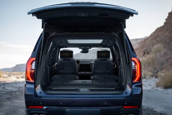 The open trunk of a 2026 GMC Yukon. New 2026 GMC Yukon & Yukon XL cargo & cabin dimensions guide at Gardner Chevrolet Buick GMC in Hope, BC