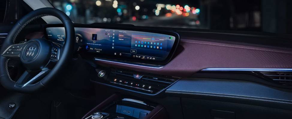 A 2026 Buick Envsision's dashboard and panoramic touchscreen on a night drive. New 2026 Buick Envision luxury features guide at Gardner Chevrolet Buick GMC in Hope, BC