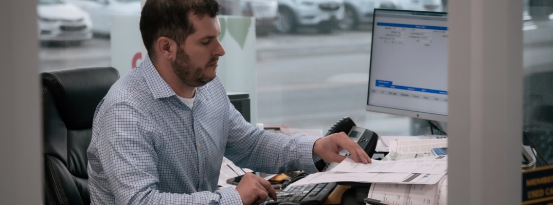 A member of our team buying a car from a customer.