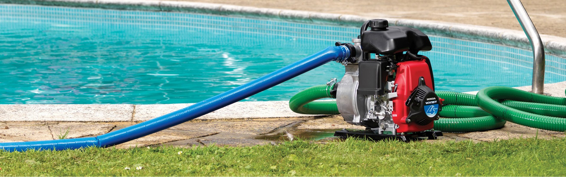 Honda water pump in front of pool
