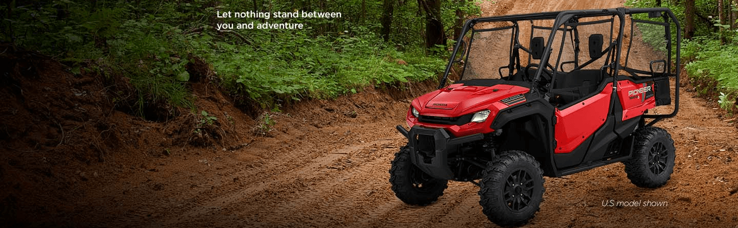 Pioneer 1000 on dirt trail with lettering