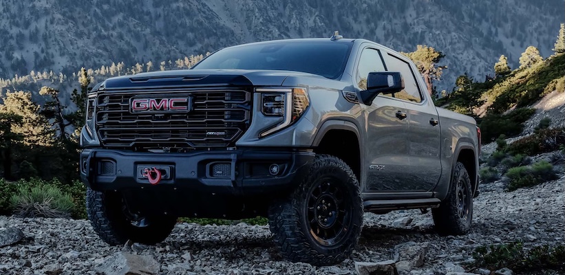 Exterior of 2025 GMC Sierra 1500 AT4 in front of mountains.
