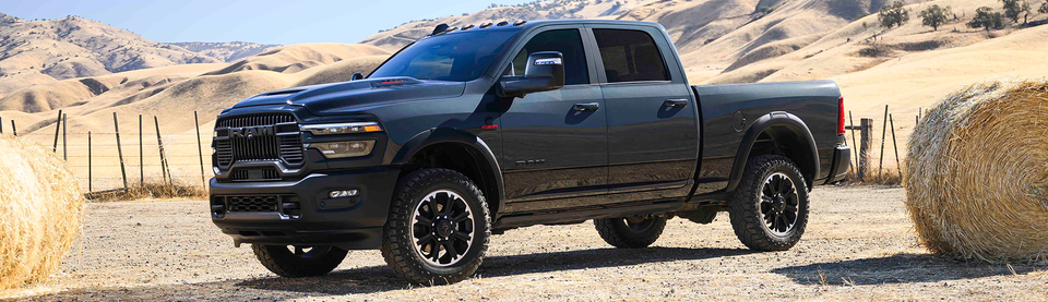 Ram 2500 parked on sandy terrain