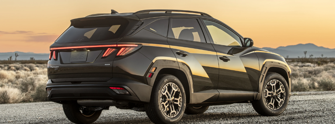 The side of a 2025 Tucson PHEV at sunset
