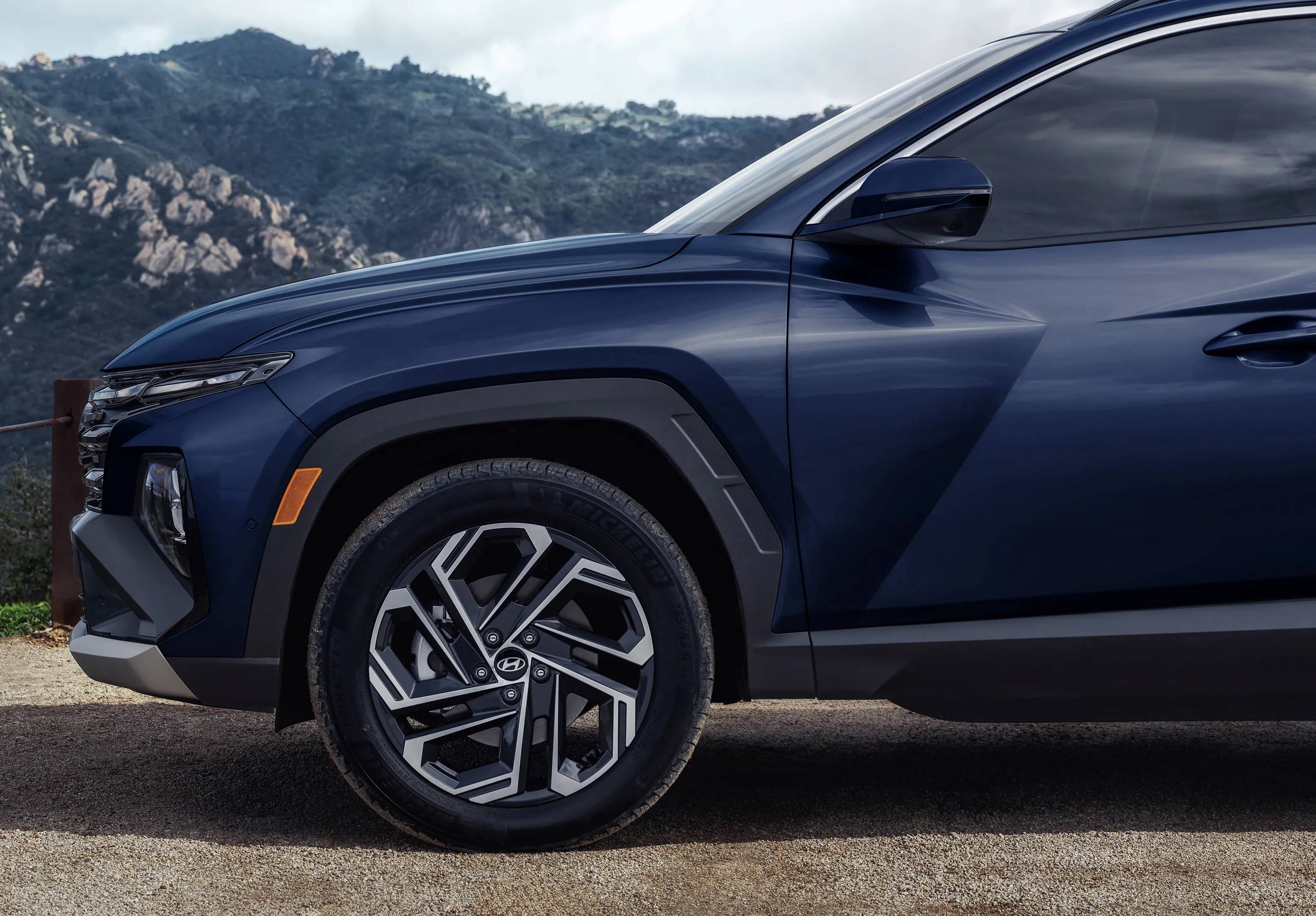 A 2026 Hyundai Tucson's hood seen from the side