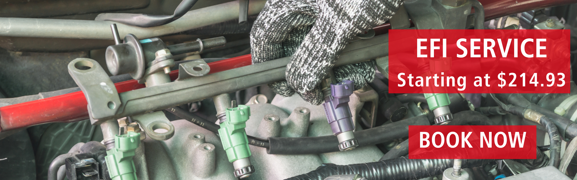 Technician performing EFI Service on a Toyota engine at Kanata Toyota