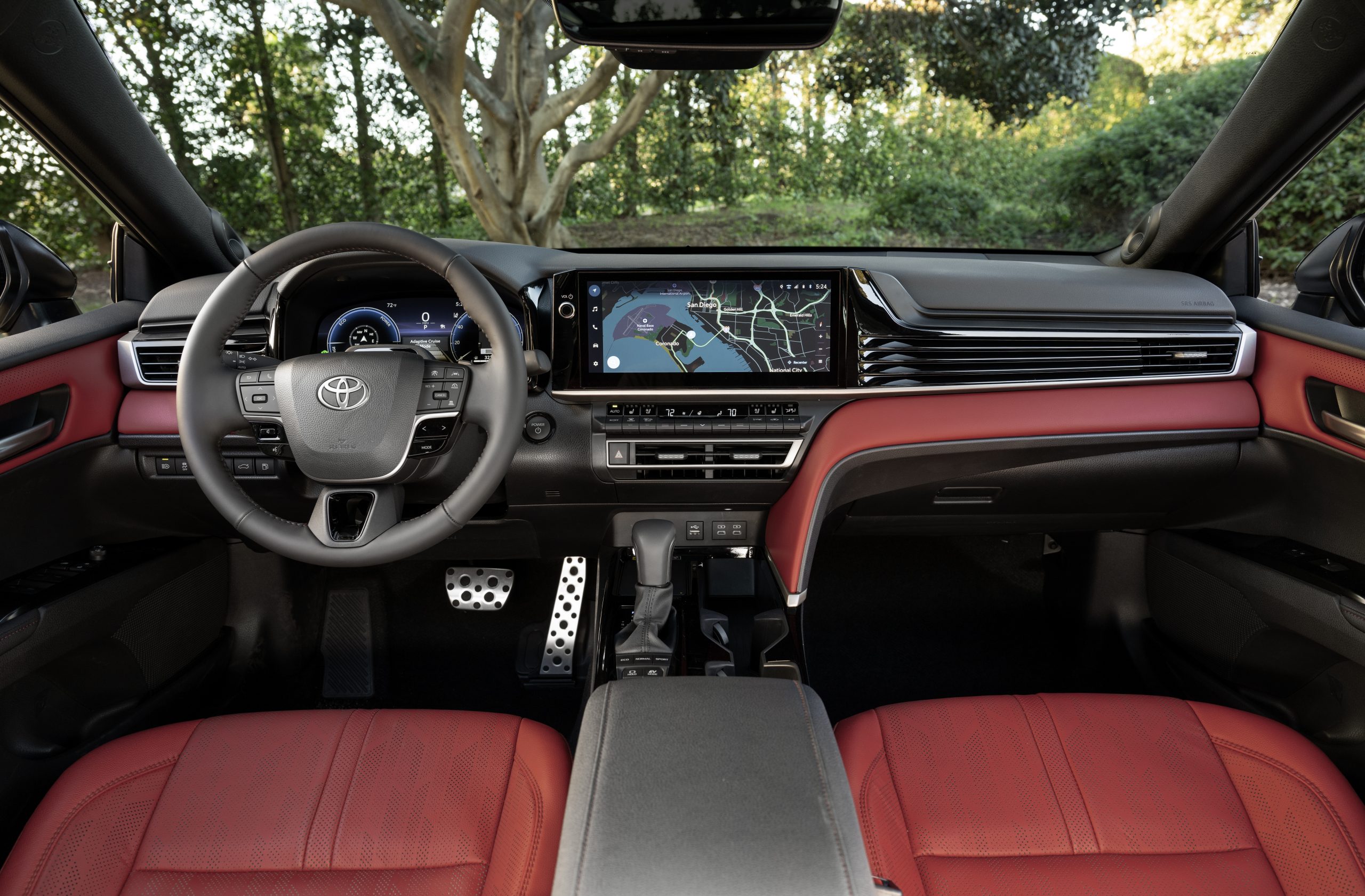2026 Toyota Camry XSE interior with red leather seats and digital display.