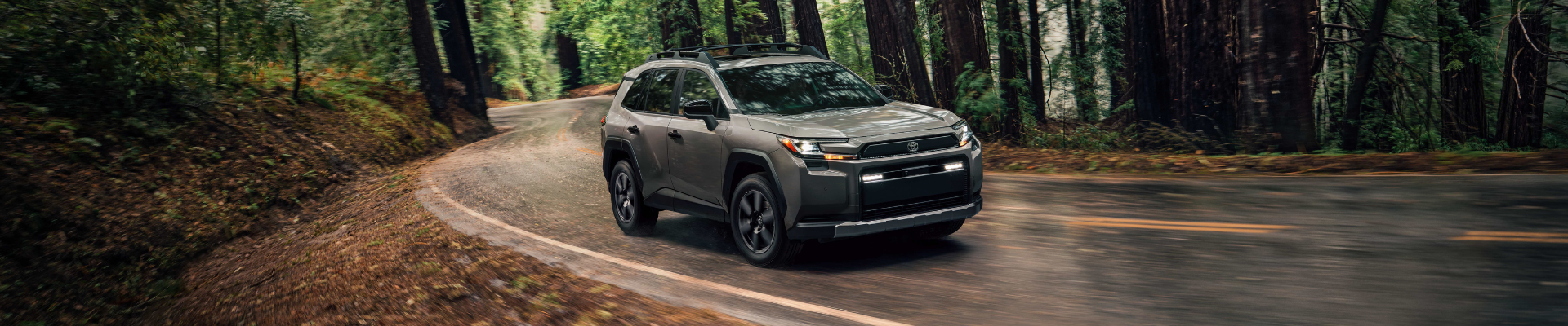 2026 Toyota RAV4 driving on a forest road available at Kanata Toyota in Ottawa