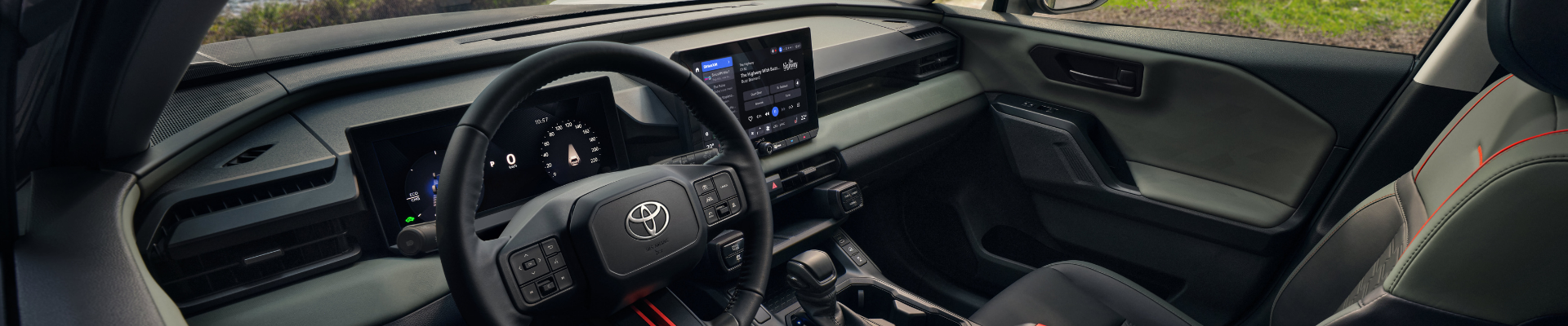 Interior of the 2026 Toyota RAV4 Limited showing dashboard, touchscreen display and panoramic glass roof at Kanata Toyota Ottawa