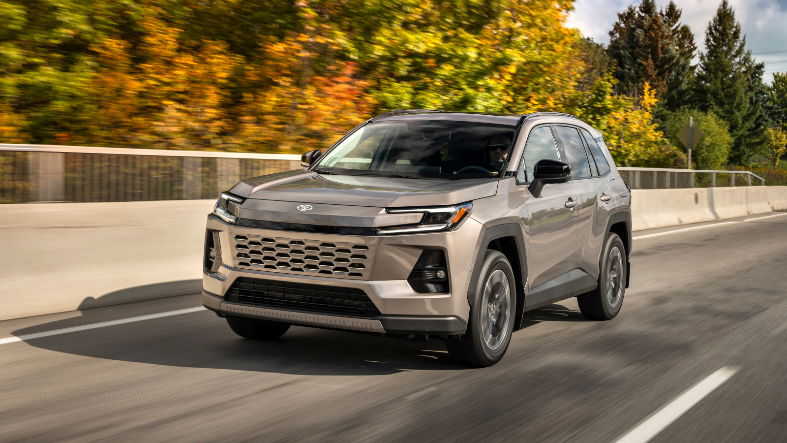 2026 Toyota RAV4 driving on the road in Storm Cloud colour available at Kanata Toyota in Ottawa