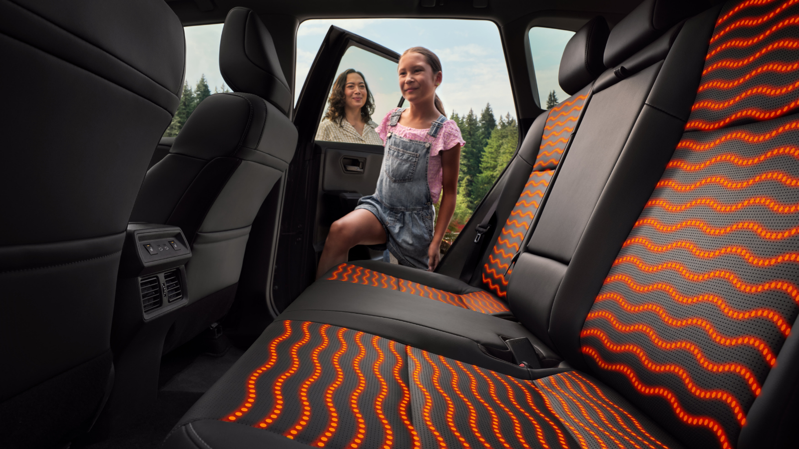 Child entering the rear seat of the 2026 Toyota RAV4 highlighting family-friendly safety features at Kanata Toyota in Ottawa