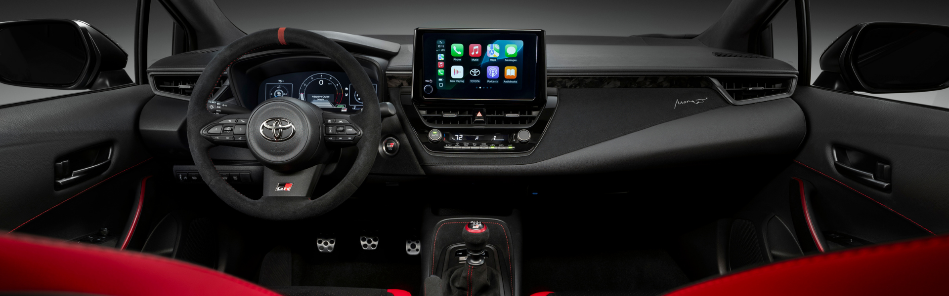 Toyota GR performance car interior with manual transmission and Apple CarPlay display