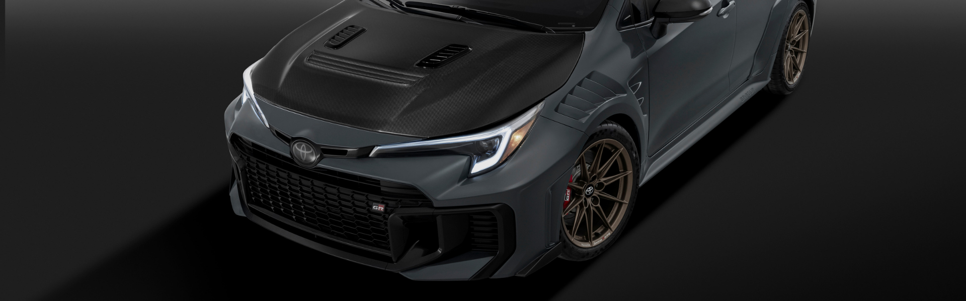 Toyota GRMN Corolla front exterior with carbon-fibre hood and bronze alloy wheels