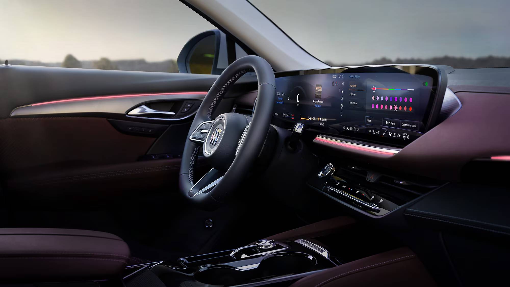A side-on view of the 2025 Buick Envision's steering wheel and infotainment system