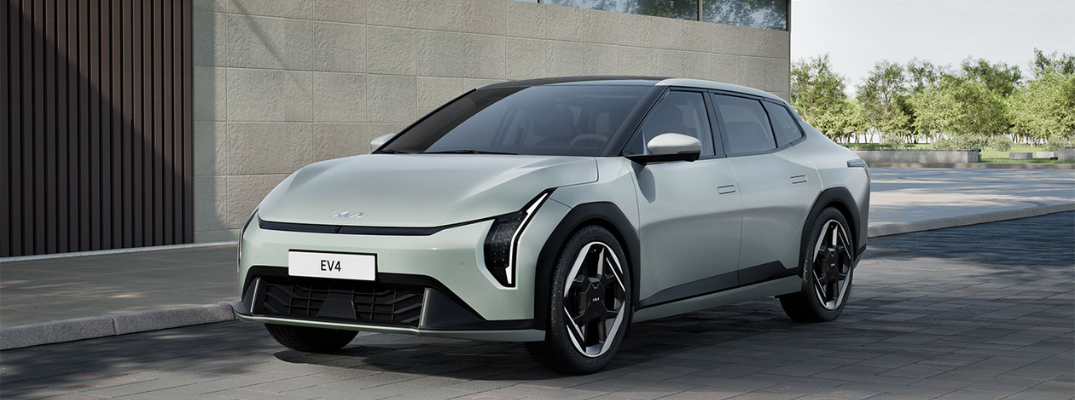 The 2026 Kia EV4 parked in front of a building