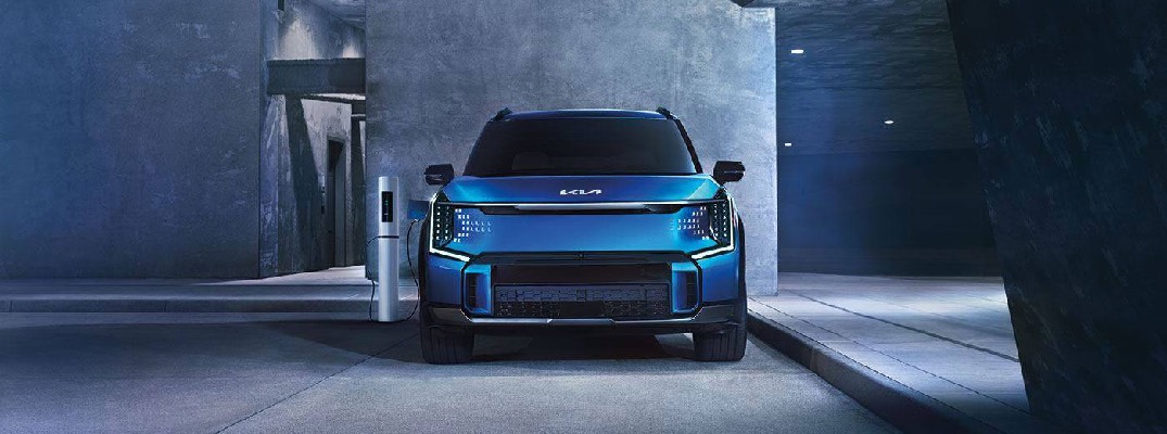 2026 EV9 plugged into a charger.