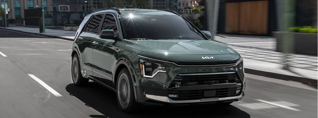 2026 Niro Hybrid SX driving down the street
