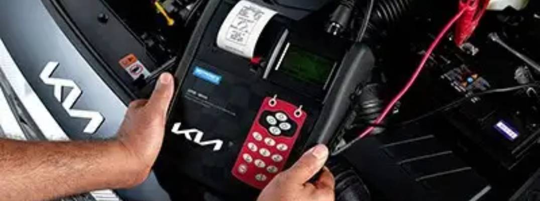 Unknown person completing inspection on Kia vehicle. 