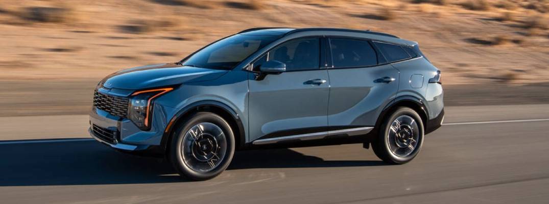 2026 Kia Sportage HEV driving down road