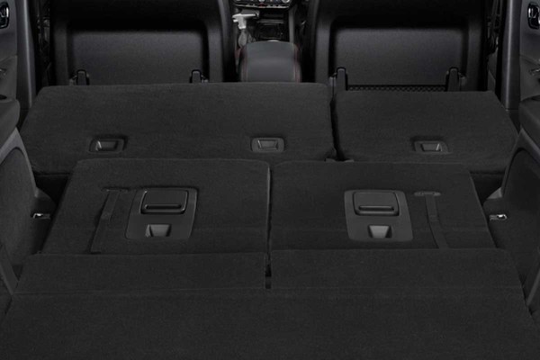 The interior of the 2026 Dodge Durango. The back seats are folded down to open the full cargo capacity.