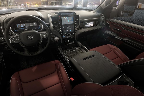 The red front seats of the 2026 Ram 1500 Laramie and a vertical digital display