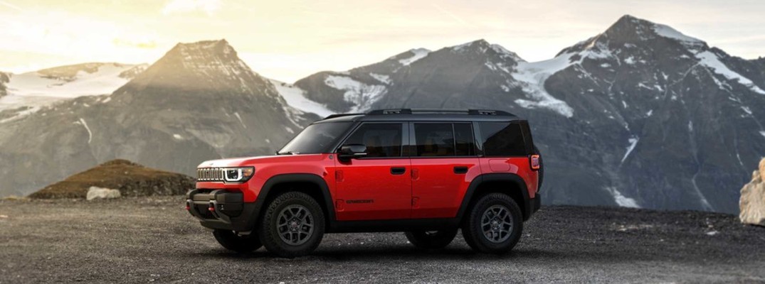 A photo of the 2026 Jeep Recon parked in front of mountains.