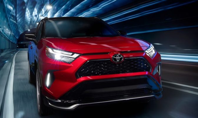 Exterior of red 2025 Toyota RAV4 Hybrid.
