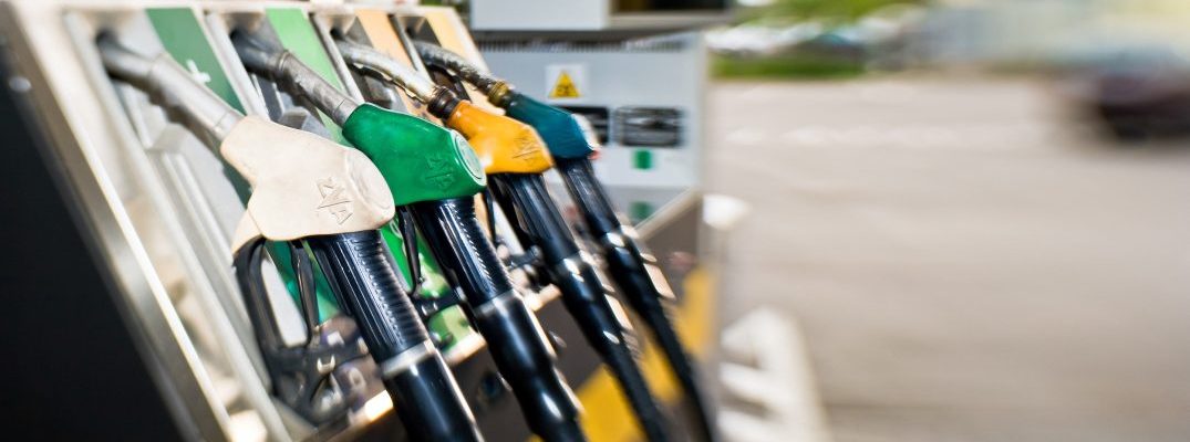 Closeup of multiple pumps at a fuel station.