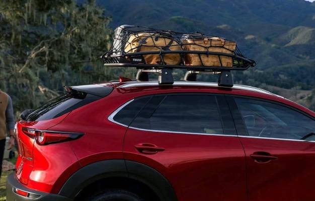 The available roof rack of a 2025 Mazda CX-30 is packed with bags