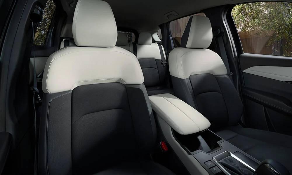The interior cabin of the 2026 Mazda CX-5 with black and white upholstered seats