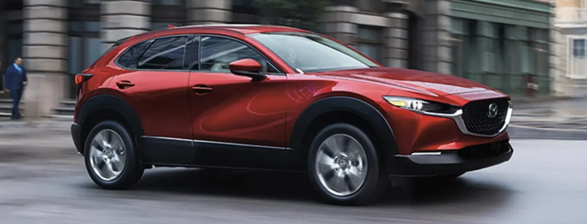 Side view of 2026 Mazda CX-30 driving in city