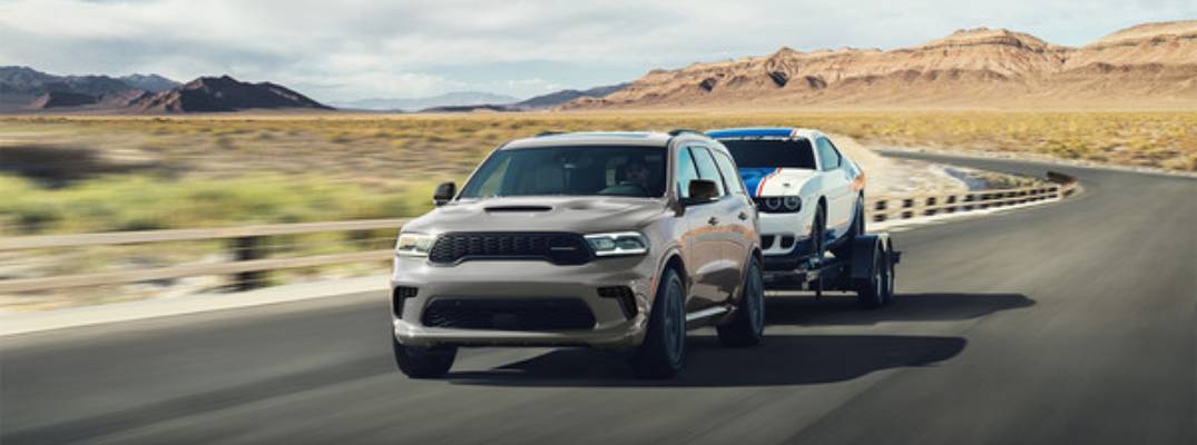 2025 Dodge Durango towing a vehicle.