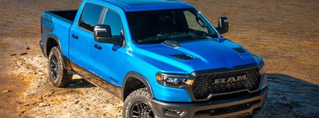 2026 Ram 1500 Rebel driving on dirt terrain