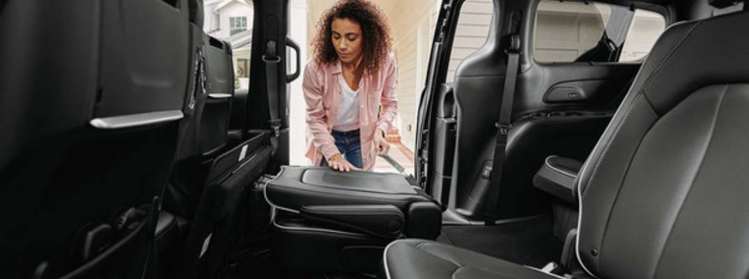 Unknown person folding Stow 'n Go® Seats 