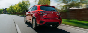 2026 Mitsubishi RVR driving down a neighborhood