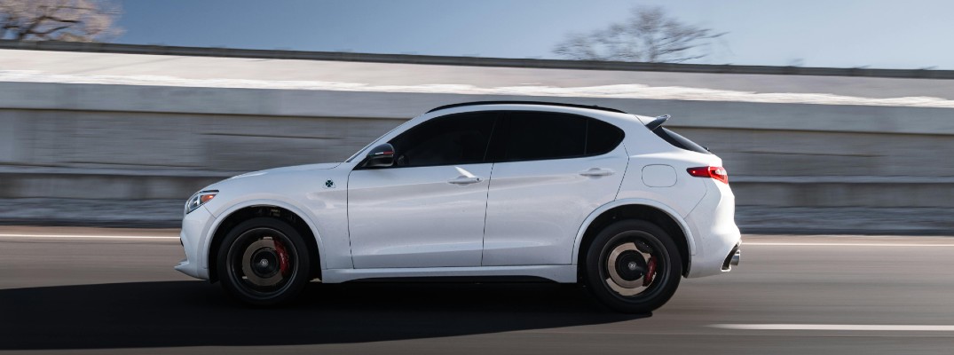 A stock photo of a luxury SUV on the road.