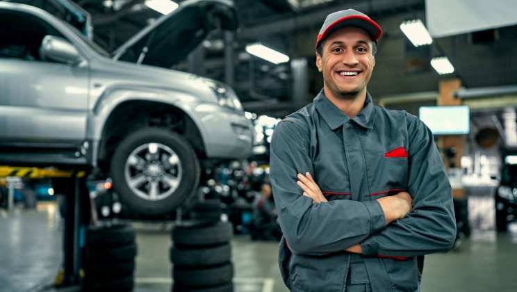 Service technician standing in car shop