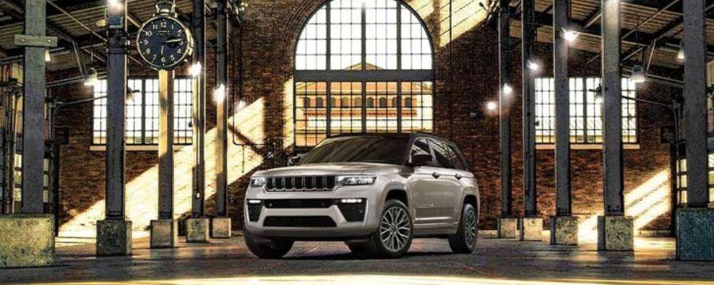 a silver 2026 jeep grand cherokee sits inside of a station. 2026 jeep grand cherokee design at orangeville chrysler dodge jeep ram in orangeville, on