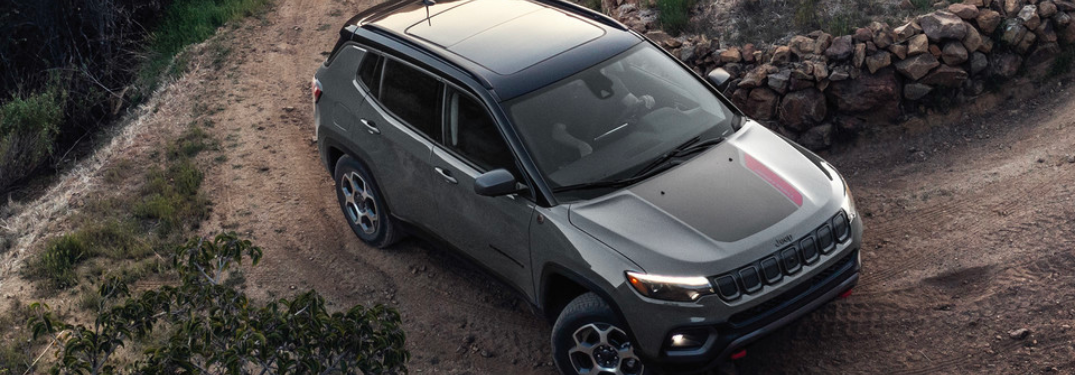 2022 Jeep Compass driving off-road up a hill