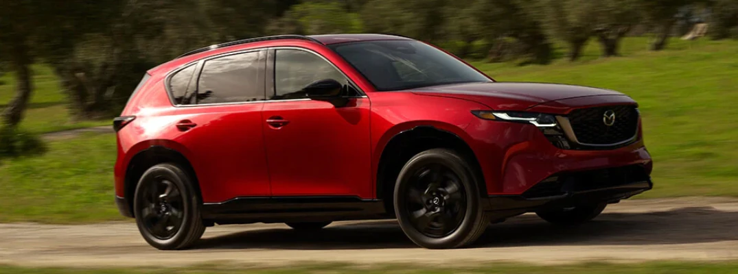 2026 Mazda CX-5 driving down a street