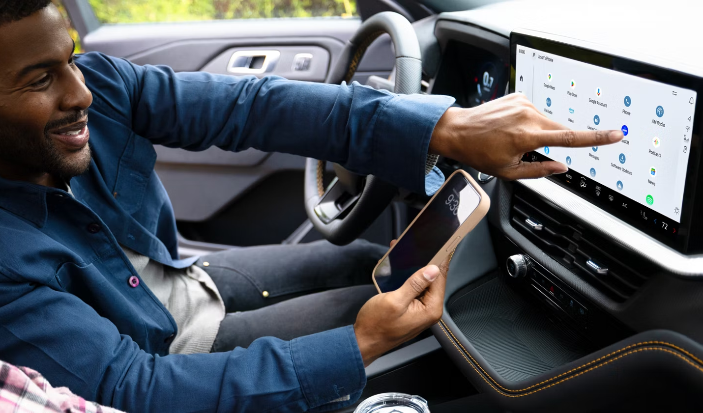 Unknown person using multimedia screen inside 2026 Ford Explorer