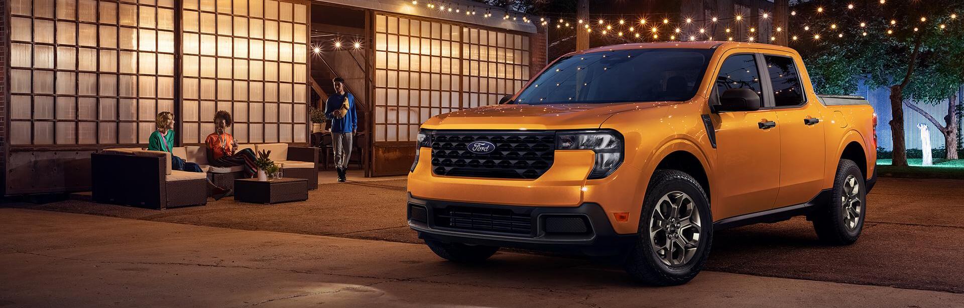 2026 Ford Maverick parked outdoors with people seated nearby