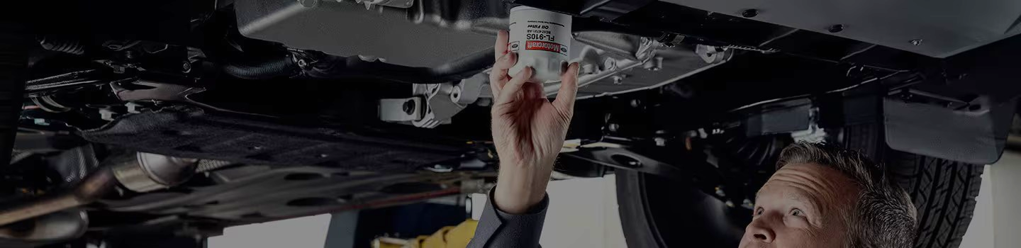 Ford tech working on vehicle