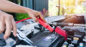 Tech attaching jump start cables