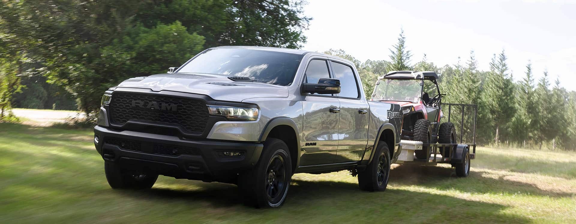 Ram 1500 towing a cart across grass