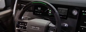 The steering wheel and interior of the 2027 GMC Sierra 1500.