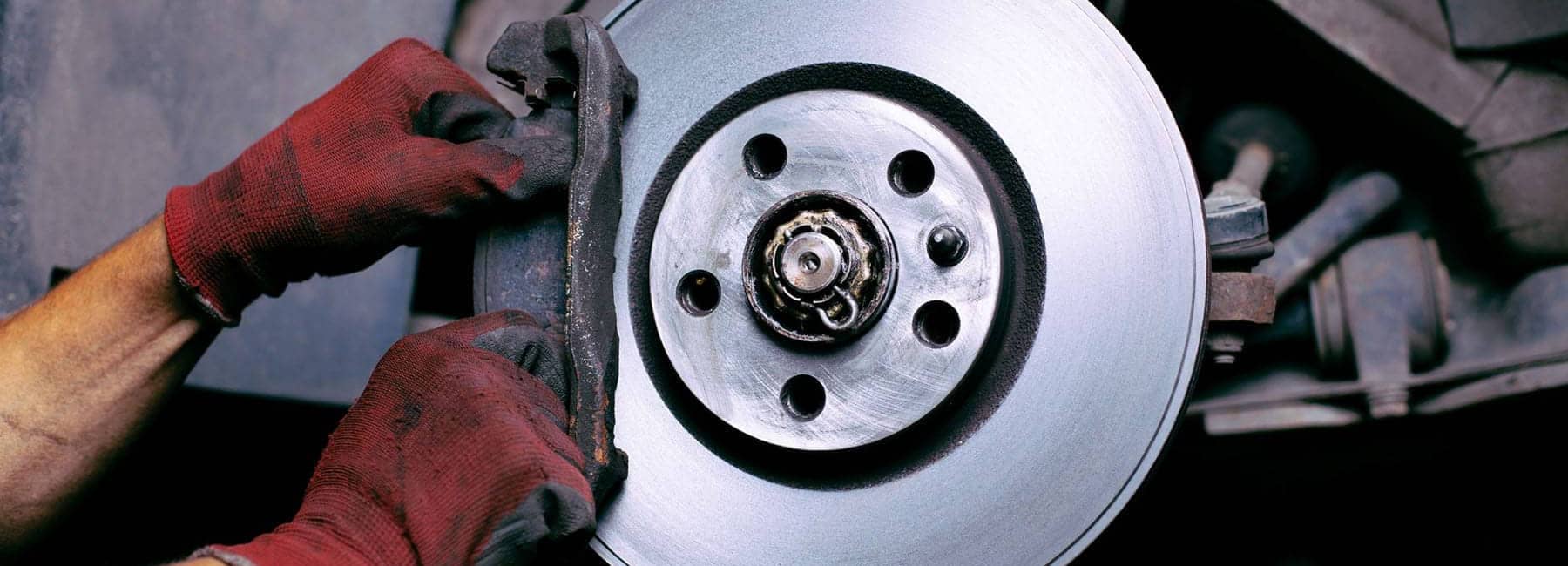 a-service-technician-replacing-the-brake-calipers-on-a-used-vehicle