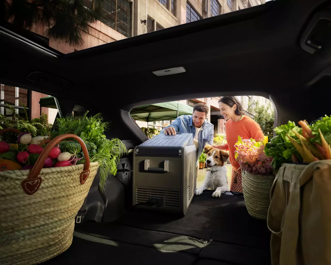 Unknown people loading things in truck of2026 Toyota bZ